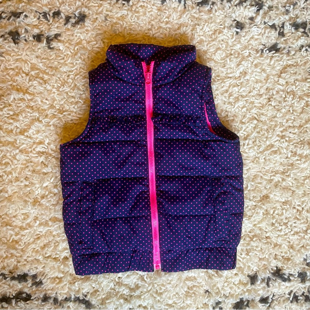 Navy blue and pink polka dot puffer vest